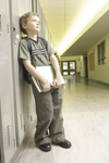 Boy leaning on lockers