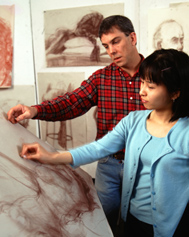 eacher helping student in drawing class